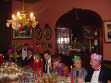 Friends are served by family members in the formal dining room